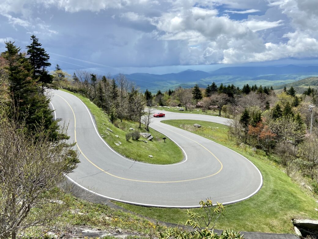 curvy road up Grandfather Mountain in North Carolina with sky and trees