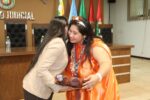 Women embrace at the Bolivian tribunal during book presentation for Laguna Chica