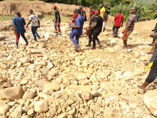 Community members looking at impacts of mining in Ghana