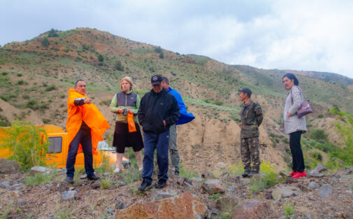 People walking around on mining land in Kyrgyzstan