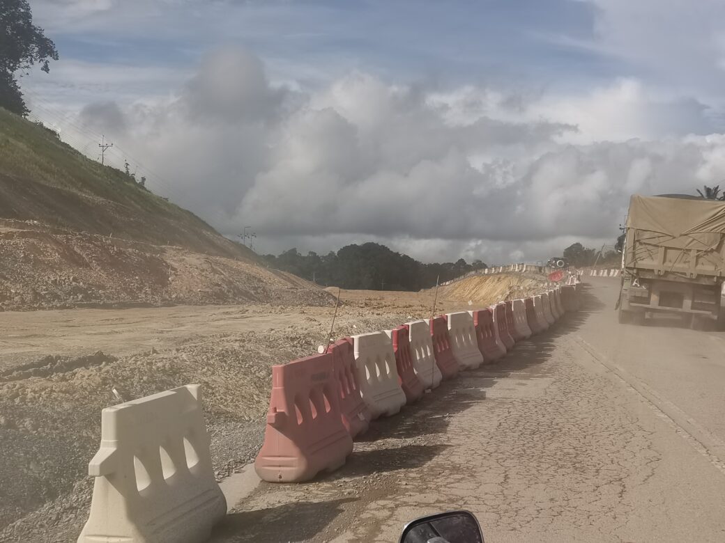 Dusty road, an image of the Pan-Borneo Highway near Sebangkoi Park, Sarawak