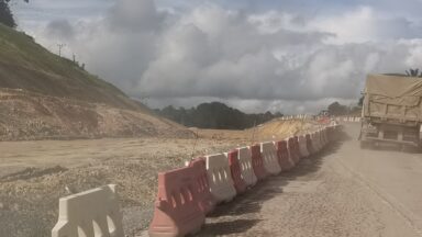 Dusty road, an image of the Pan-Borneo Highway near Sebangkoi Park, Sarawak