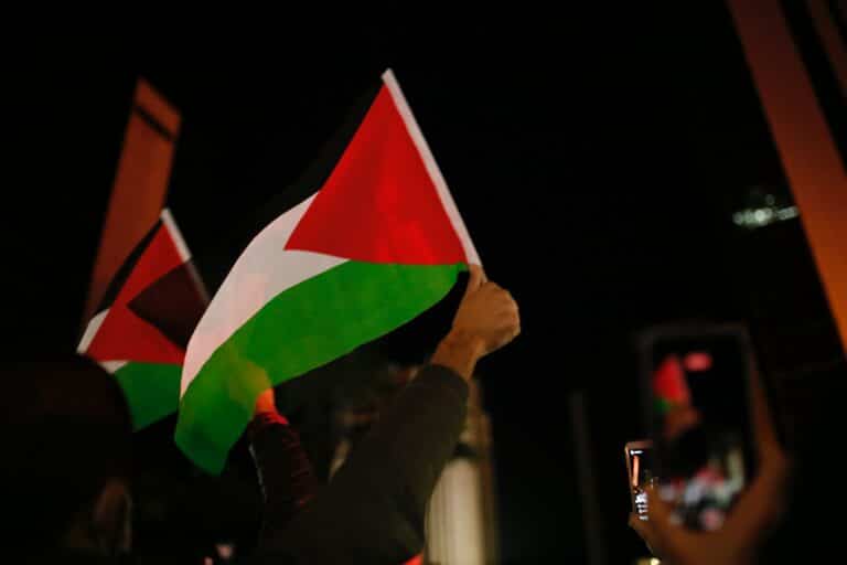 Palestinian flag waving in darkness
