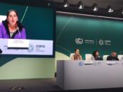 Andrea Echeverri of GFC speaking at a press conference at the climate change conference in baku, with other speakers on stage