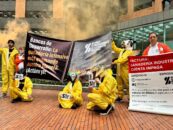 Demonstrators holding banners outside the World Bank offices in Bogota, Colombia
