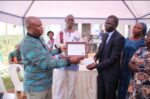 Frank Murazumi recieving an award on behalf of NAPE Uganda