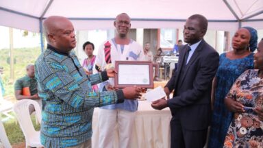 Frank Murazumi recieving an award on behalf of NAPE Uganda
